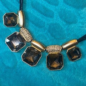 Exotic multi-gem Onyx with facet cut set in a handcrafted necklace setting